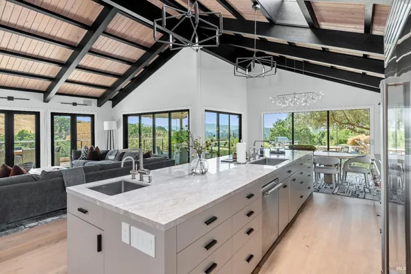 a kitchen with a stove a sink and a refrigerator