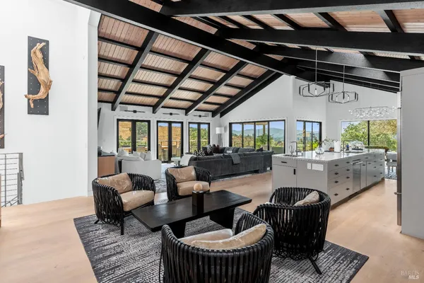 a living room with furniture and a table