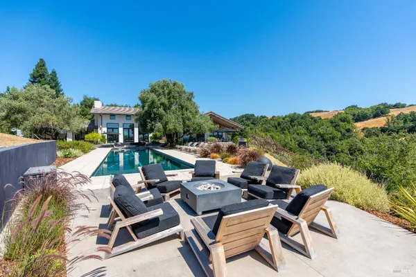 a view of a patio with swimming pool