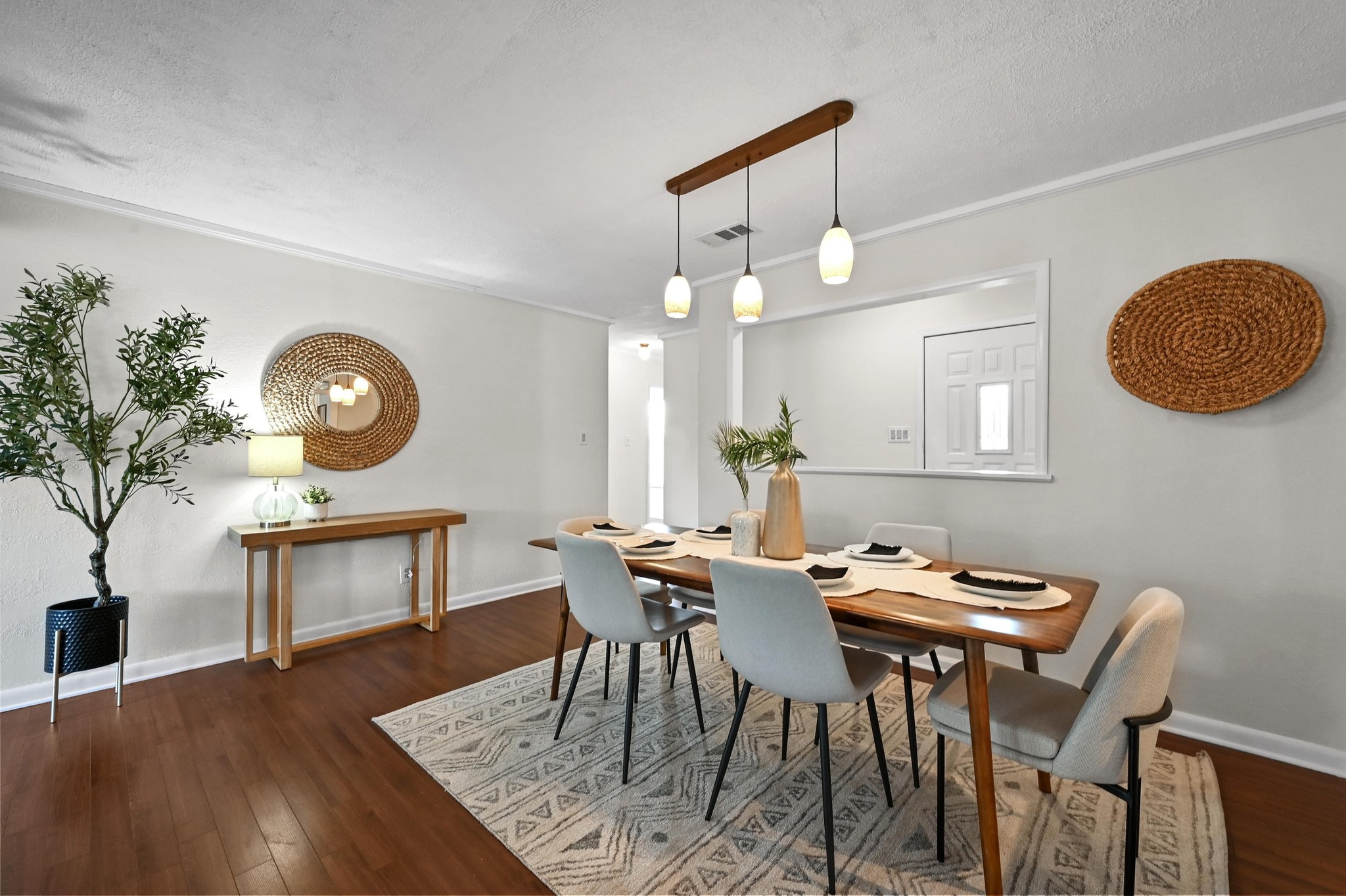2018 Chaparral Park Road Manchaca, TX 78652 - Photo 3 of 14 a view of a dining room with furniture and wooden floor