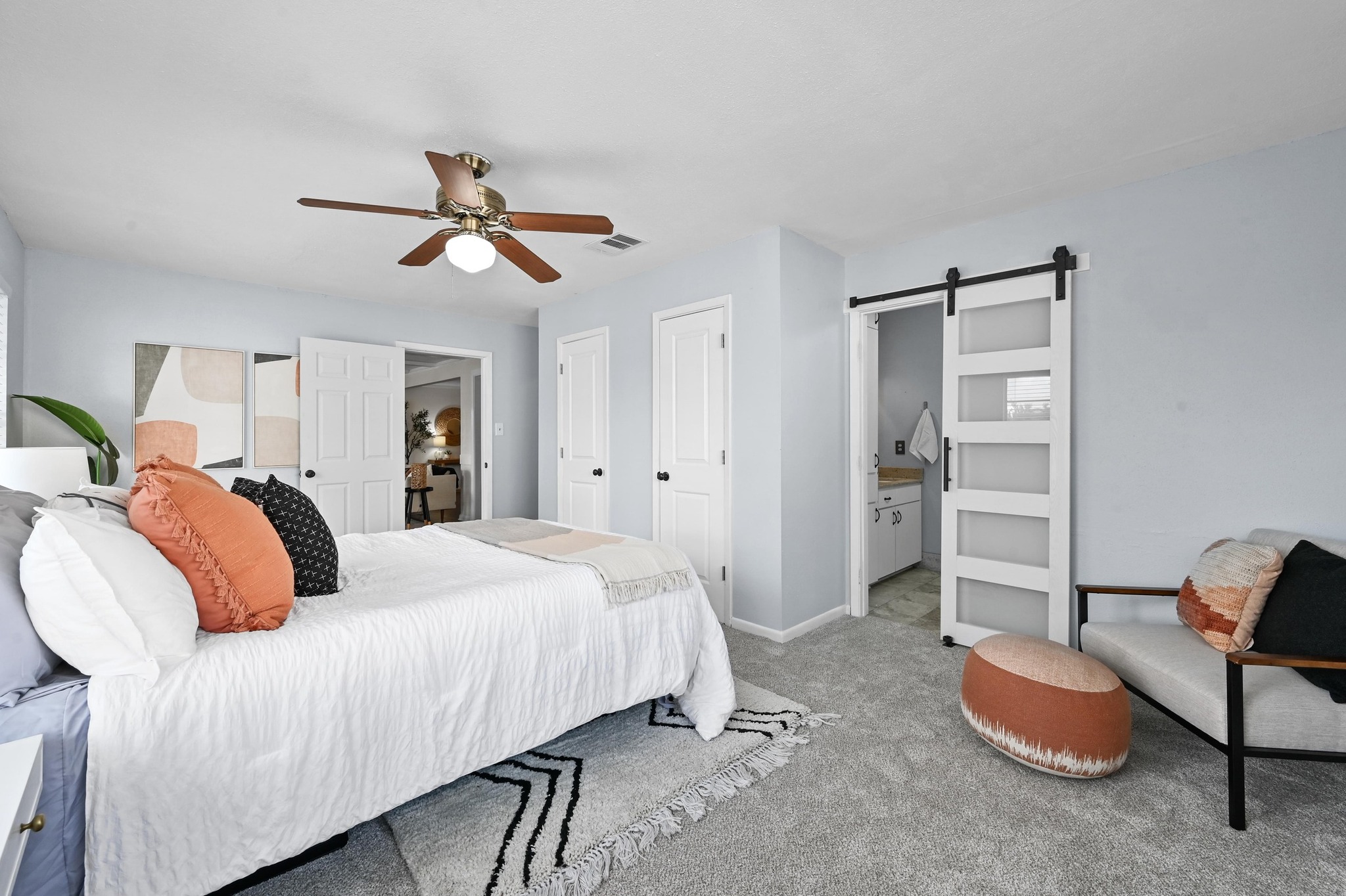 2018 Chaparral Park Road Manchaca, TX 78652 - Photo 6 of 14 a bedroom with a bed and a chandelier