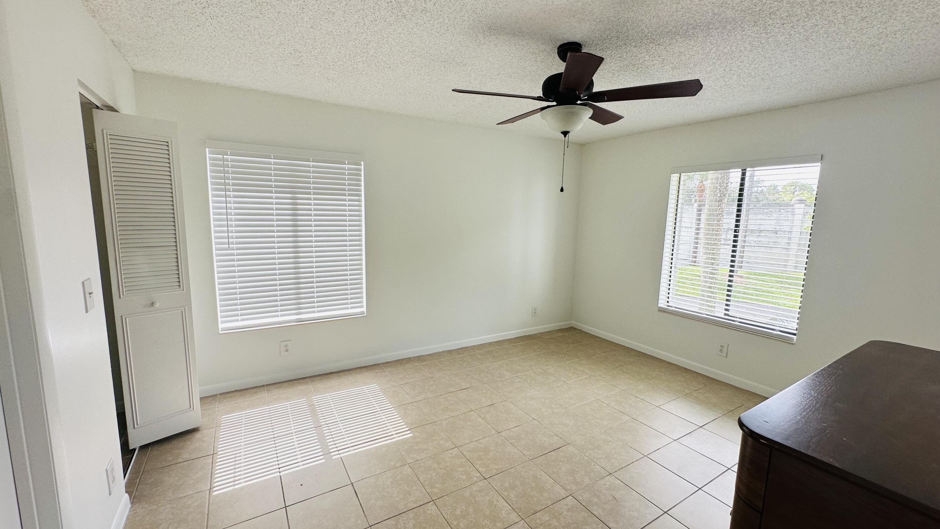 1006 Green Pine Boulevard, Unit H2 West Palm Beach, FL 33409 - Photo 6 of 12 a view of an empty room with a window