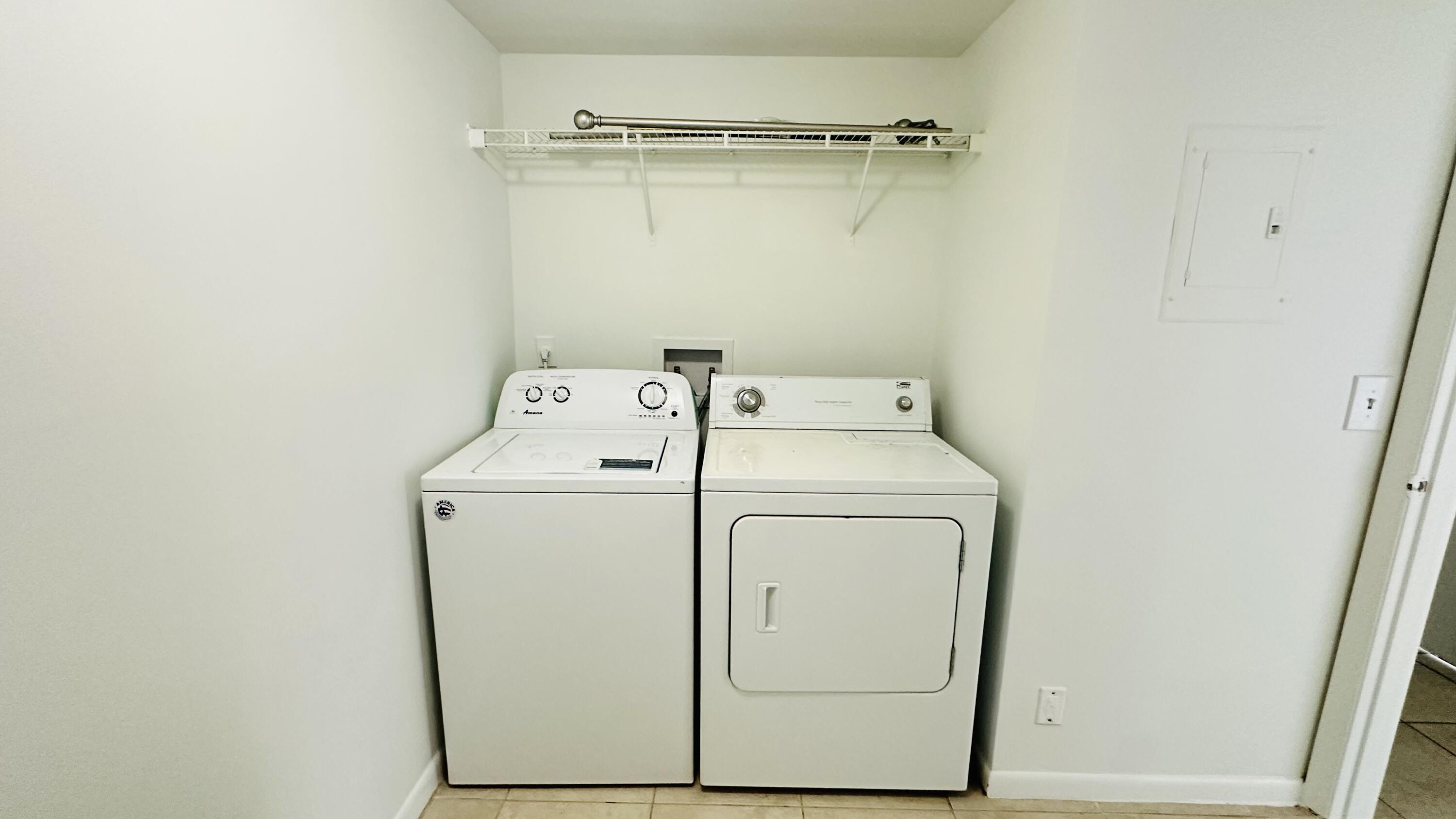 1006 Green Pine Boulevard, Unit H2 West Palm Beach, FL 33409 - Photo 9 of 12 a utility room with dryer and washer