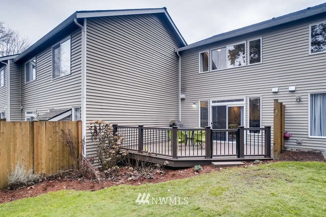 21624 9th Avenue Southeast, Unit D104 Bothell, WA 98021 - Photo 15 of 16 a front view of a house with a garden