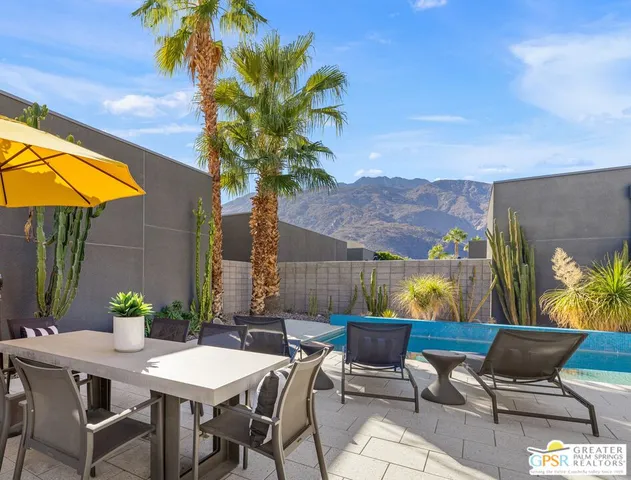 a view of a patio with a table and chairs