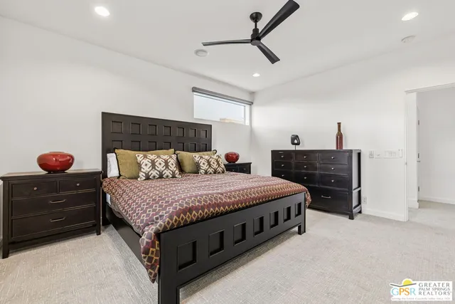 a bedroom with a bed and a dresser