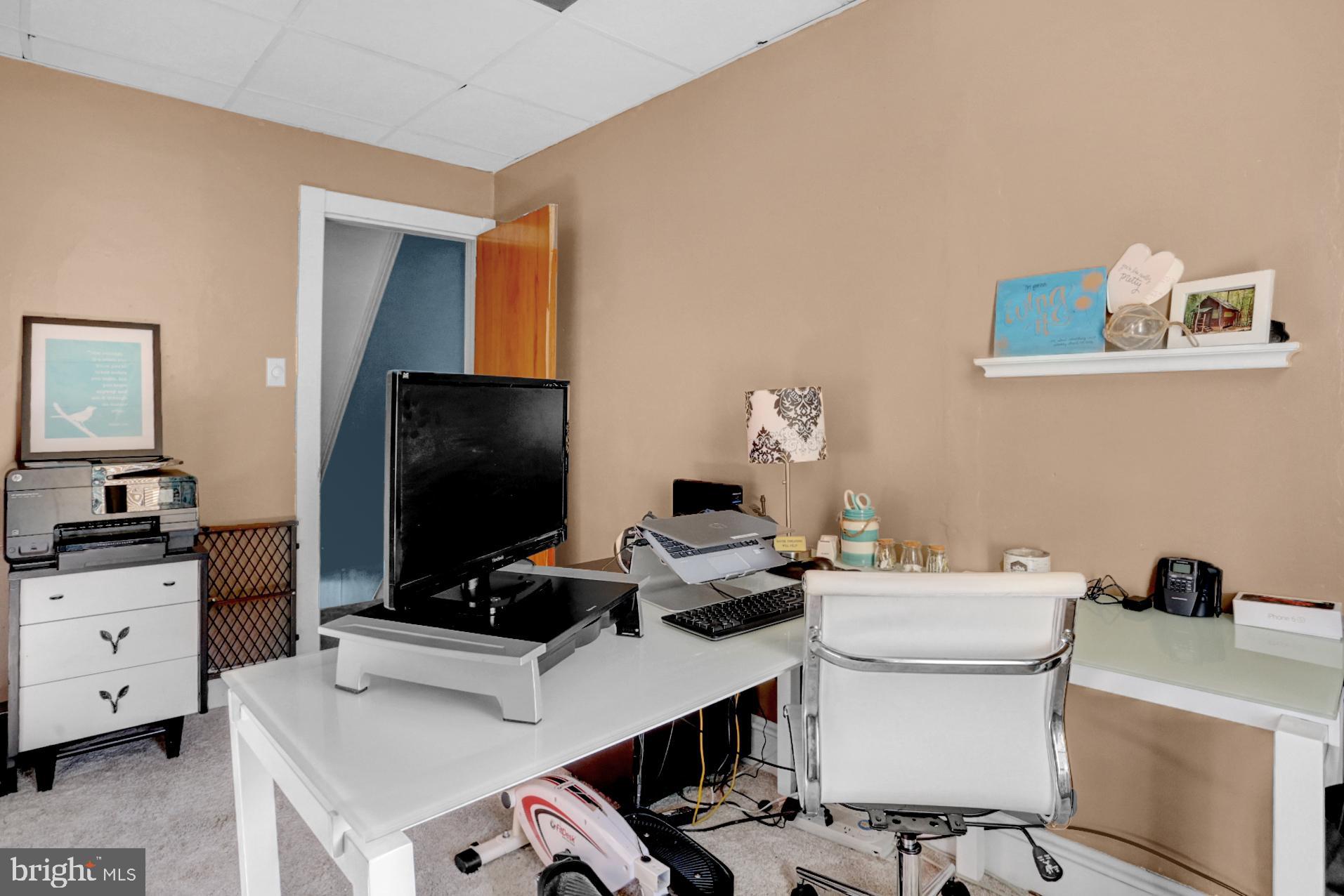 230 South 18th Street Reading, PA 19602 - Photo 13 of 24 a work room with table chairs and flat screen tv
