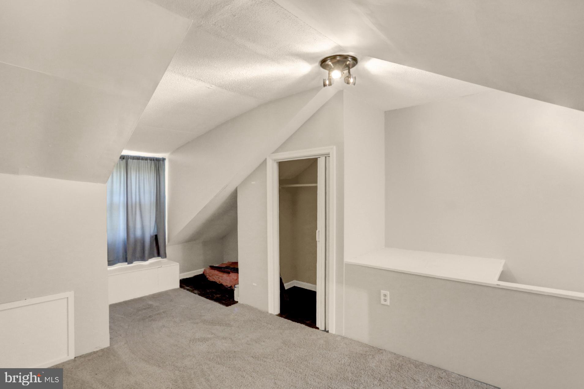 230 South 18th Street Reading, PA 19602 - Photo 19 of 24 a view of a livingroom with a staircase