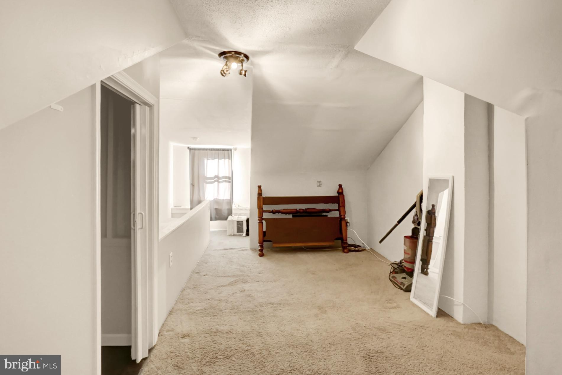 230 South 18th Street Reading, PA 19602 - Photo 21 of 24 a living room with furniture and a chandelier