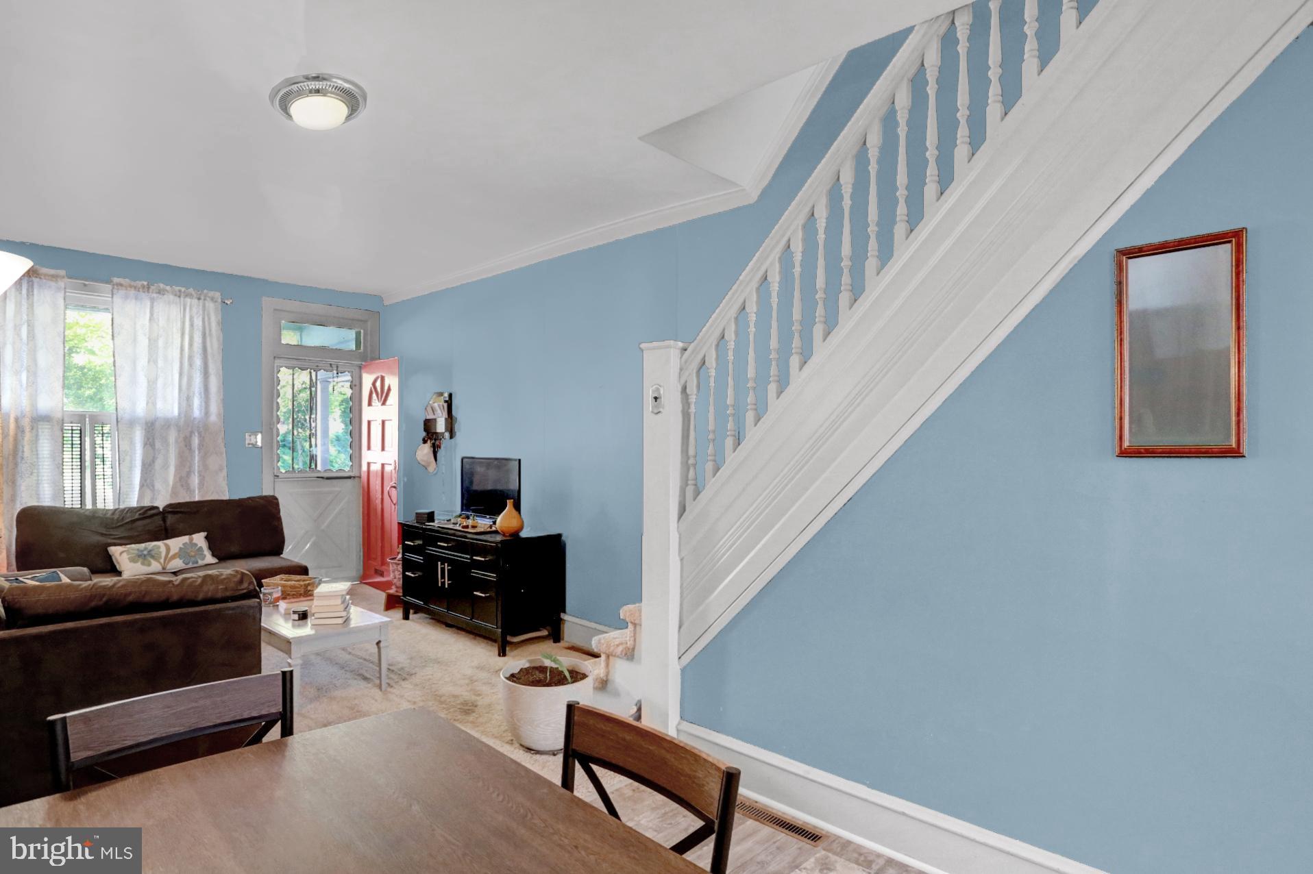 230 South 18th Street Reading, PA 19602 - Photo 8 of 24 a living room with furniture and a couch