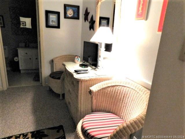 2273 Northwest 22nd Avenue, Unit 104 Stuart, FL 34994 - Photo 11 of 17 a balcony with a couch