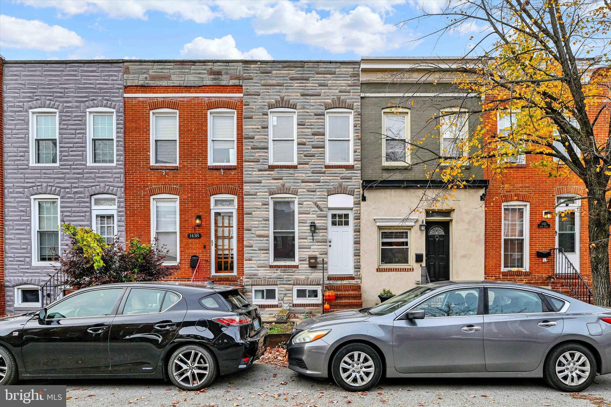a front view of a house with parking space