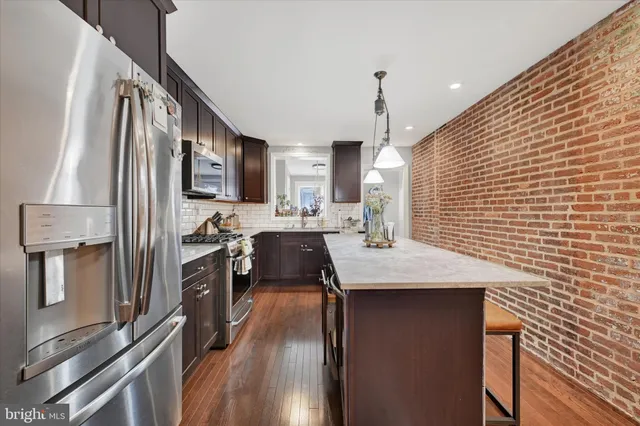 a kitchen with counter top space cabinets and stainless steel appliances