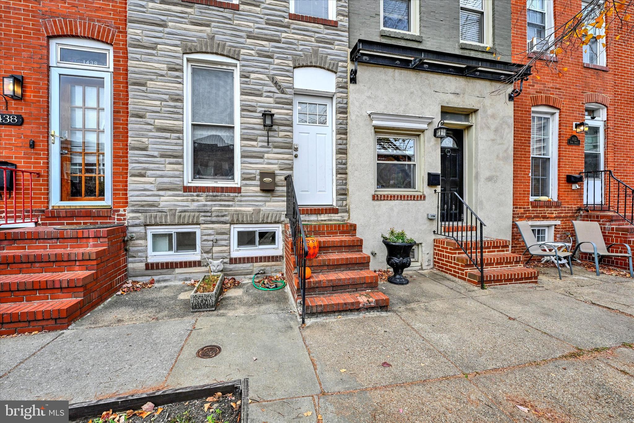 1436 Andre Street Baltimore, MD 21230 - Photo 2 of 35 a front view of a house with a garage