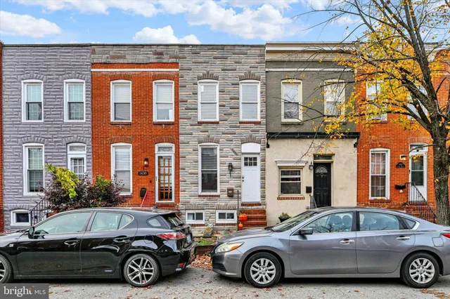 a front view of a house with parking space