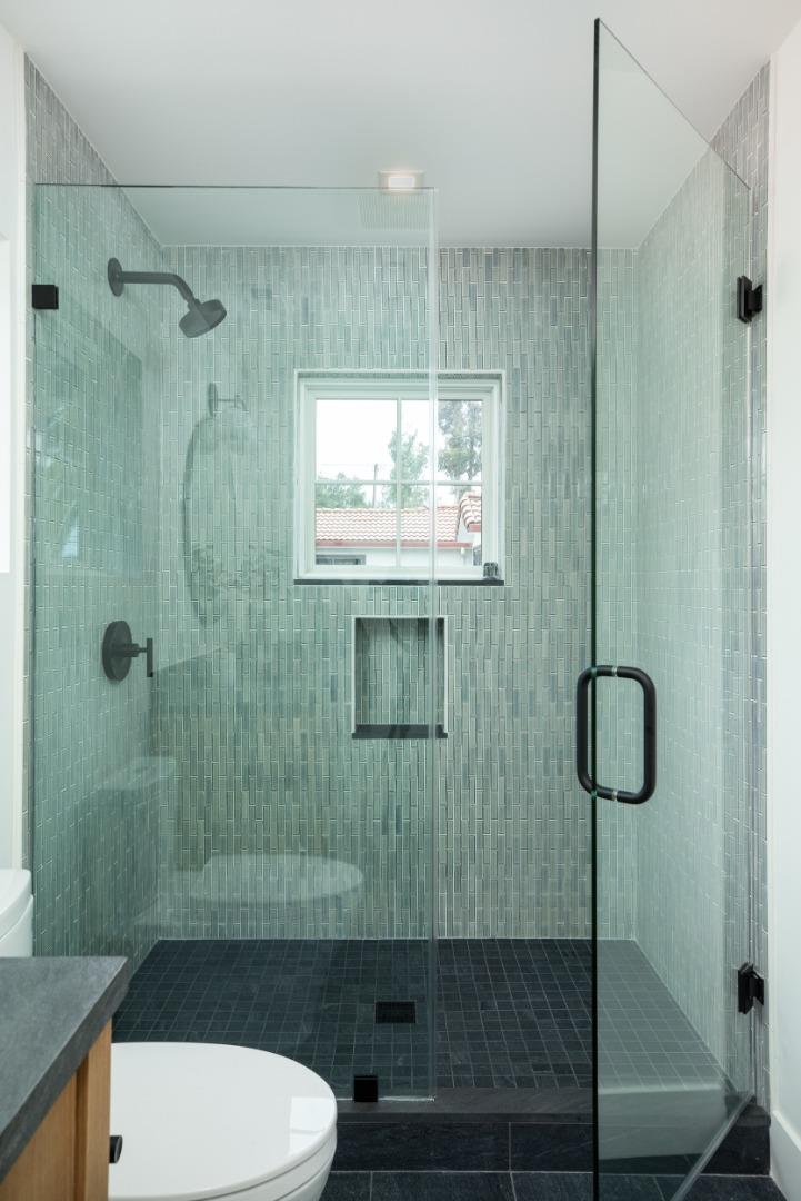 737 Linden Avenue Burlingame, CA 94010 - Photo 21 of 42 a bathroom with a shower toilet and sink