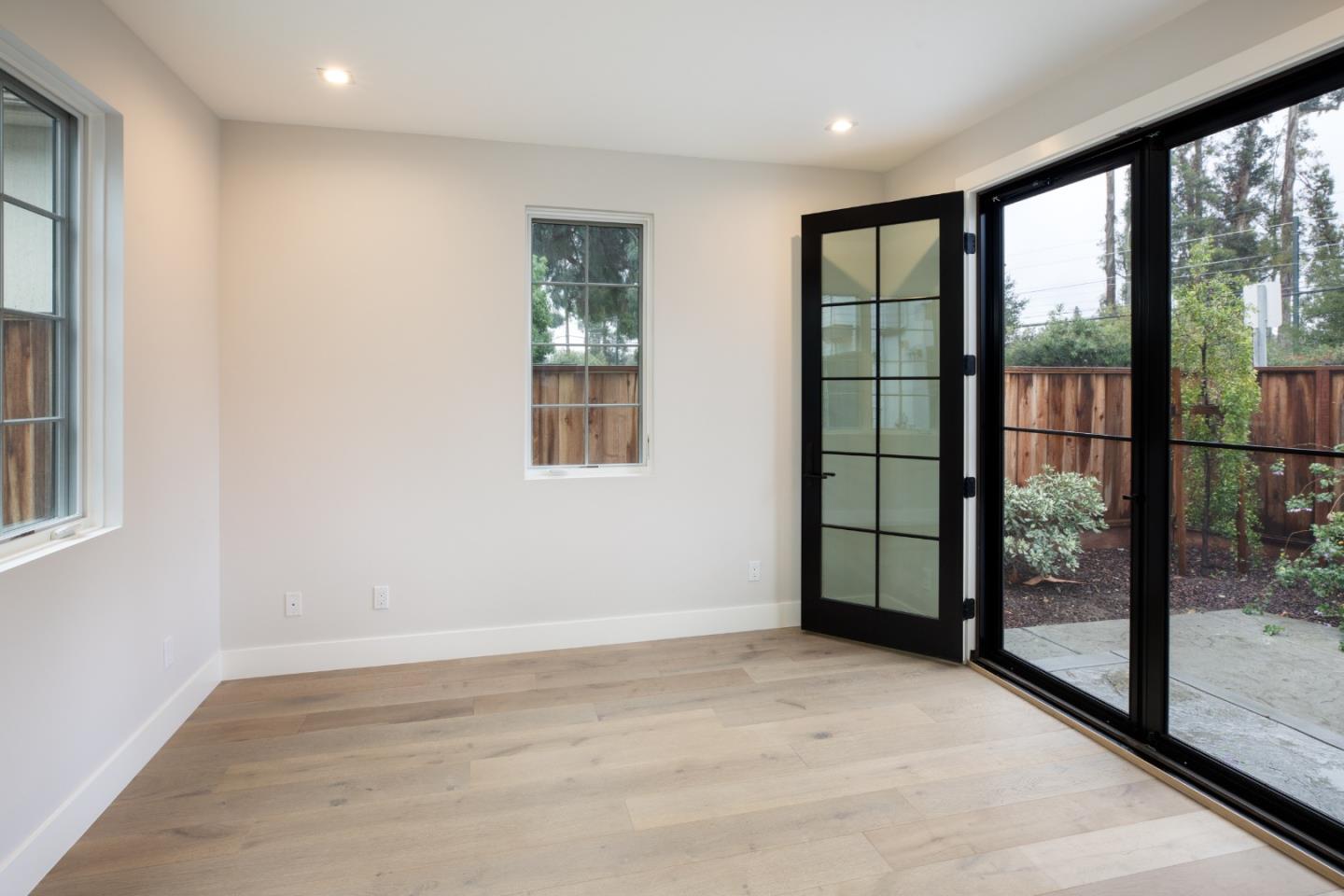 737 Linden Avenue Burlingame, CA 94010 - Photo 31 of 42 a view of an empty room with wooden floor and a window