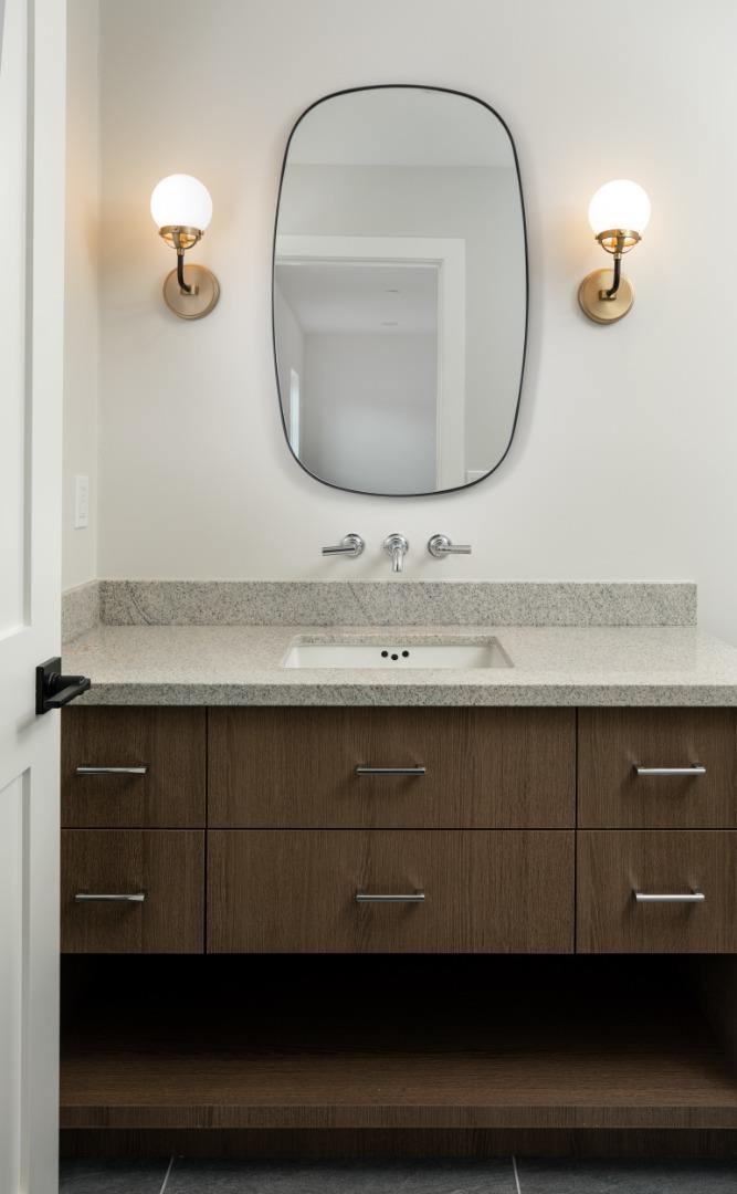 737 Linden Avenue Burlingame, CA 94010 - Photo 35 of 42 a bathroom with a sink and a mirror