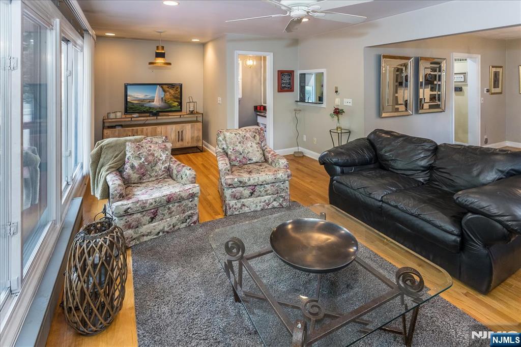 699 Kent Avenue Teaneck, NJ 07666 - Photo 12 of 31 a living room with furniture and a wooden floor