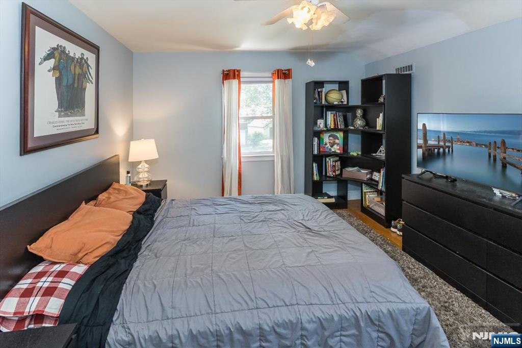 699 Kent Avenue Teaneck, NJ 07666 - Photo 20 of 31 a bedroom with bed and window