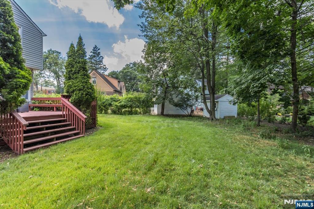 699 Kent Avenue Teaneck, NJ 07666 - Photo 25 of 31 a view of a backyard with wooden stairs