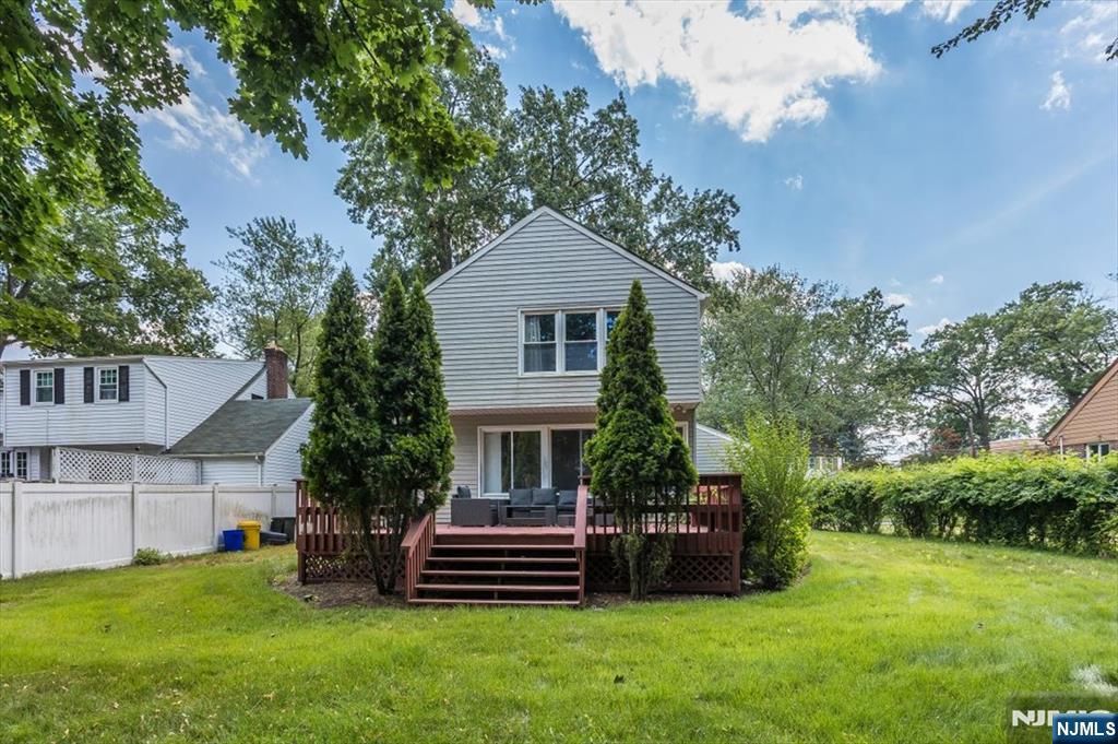 699 Kent Avenue Teaneck, NJ 07666 - Photo 26 of 31 a front view of a house with a garden
