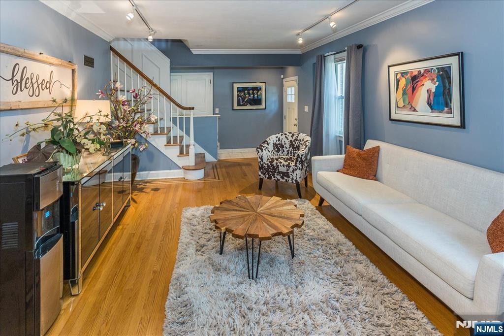 699 Kent Avenue Teaneck, NJ 07666 - Photo 6 of 31 a living room with furniture and a rug