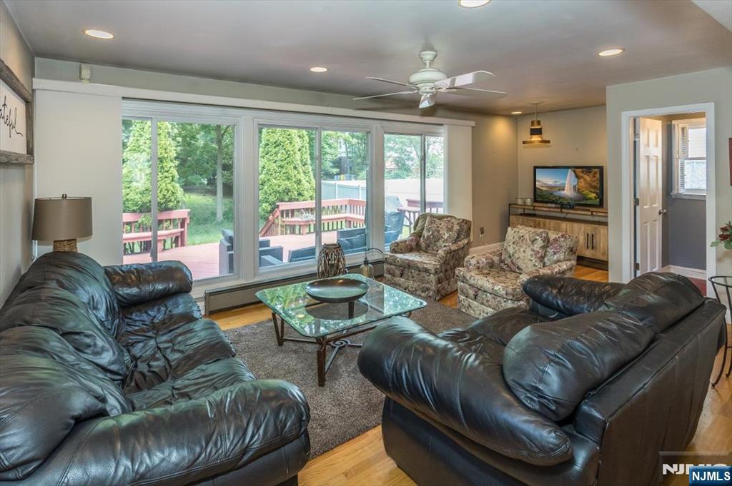 699 Kent Avenue Teaneck, NJ 07666 - Photo 10 of 31 a living room with furniture and a large window