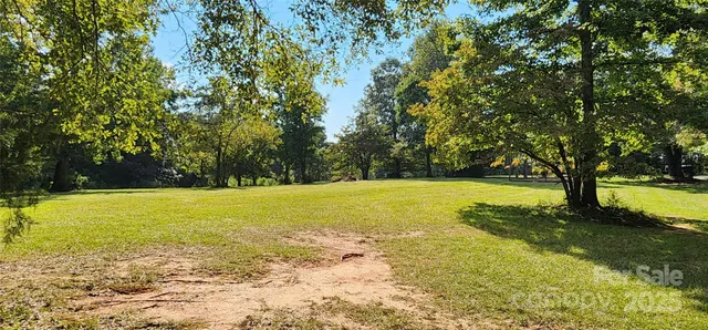 a view of a swimming pool with a bench