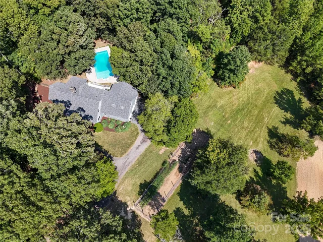 a view of a house with a yard and plants