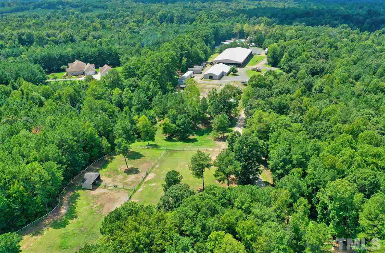 7012 Wildlife Trail Raleigh, NC 27613 - Photo 1 of 30 a backyard of a house with lots of green space