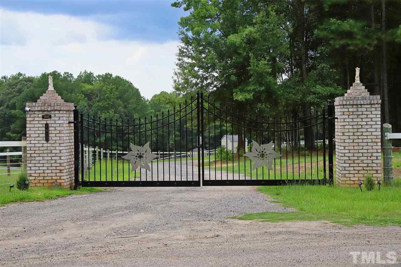 7012 Wildlife Trail Raleigh, NC 27613 - Photo 2 of 30 a view of a garden with a small yard
