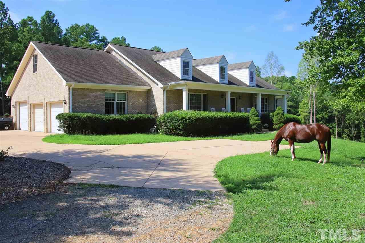 7012 Wildlife Trail Raleigh, NC 27613 - Photo 18 of 30 a front view of house with yard and green space