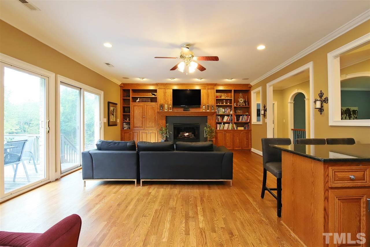 7012 Wildlife Trail Raleigh, NC 27613 - Photo 23 of 30 a living room with furniture and a fireplace
