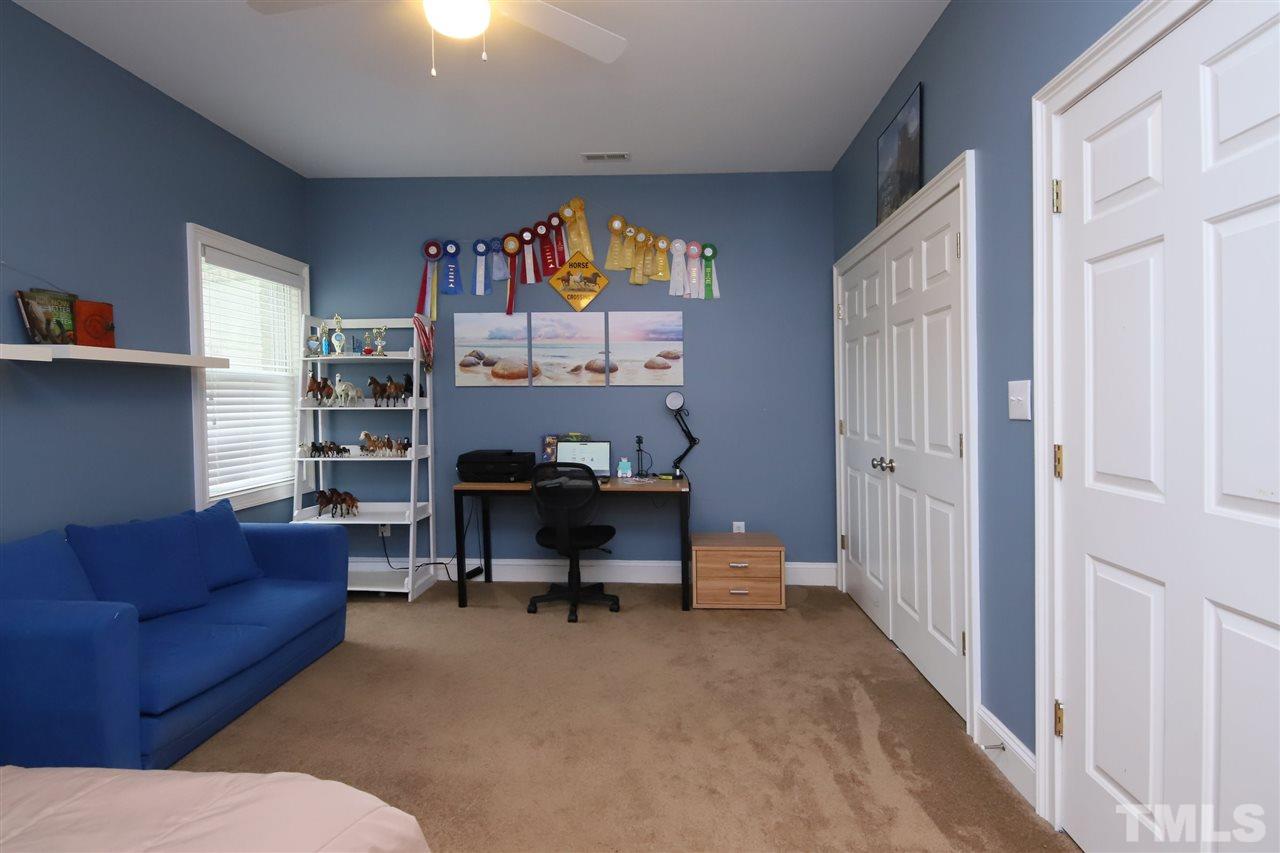 7012 Wildlife Trail Raleigh, NC 27613 - Photo 26 of 30 a view of a livingroom with workspace and a couch