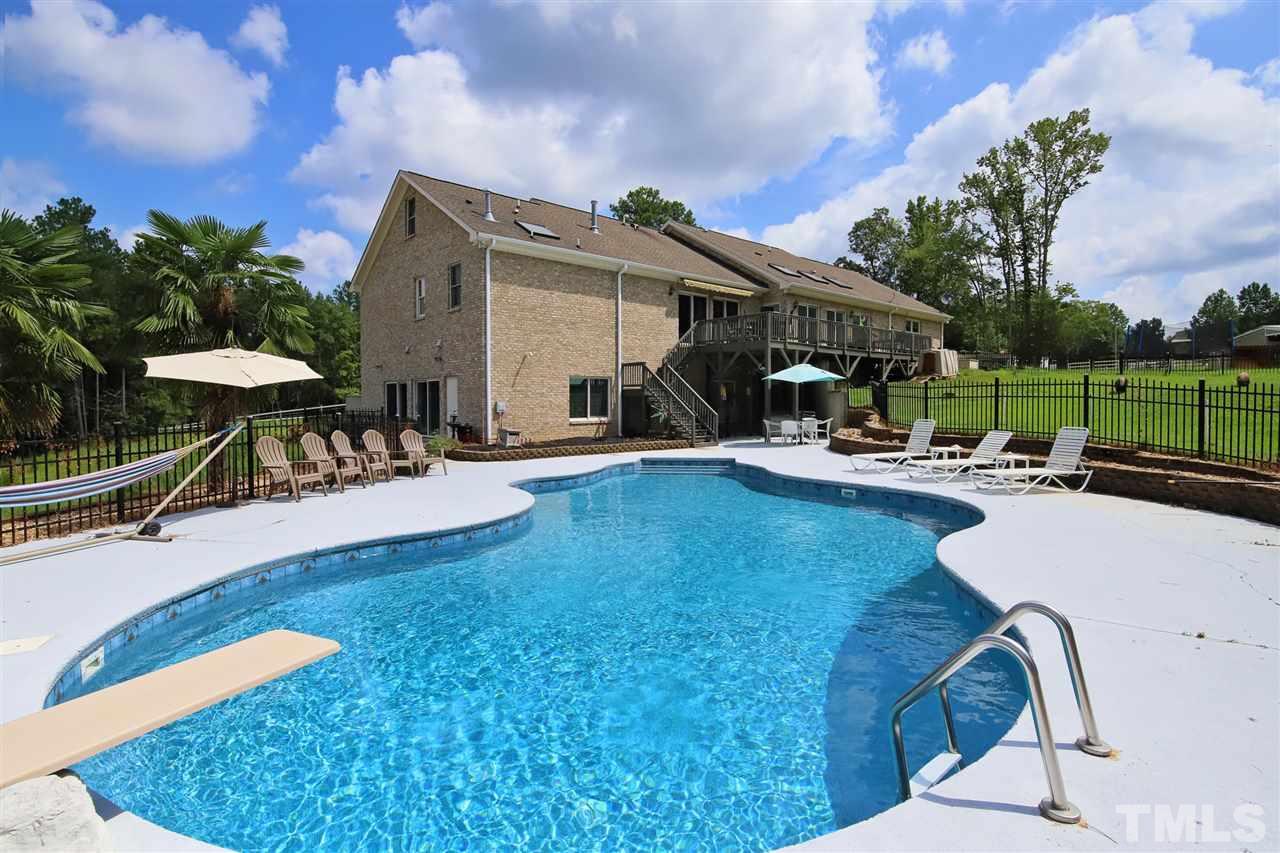 7012 Wildlife Trail Raleigh, NC 27613 - Photo 29 of 30 a patio with table and chairs