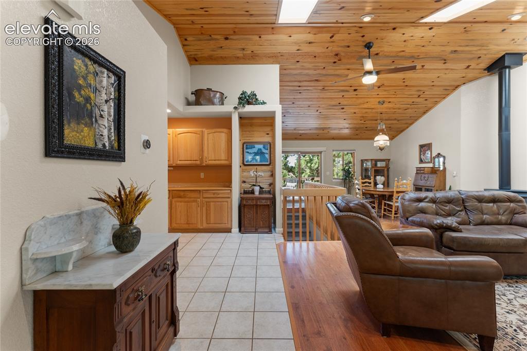 657 Spring Valley Drive Divide, CO 80814 - Photo 4 of 43 Vaulted wood-paneled ceiling with skylights and a ceiling fan