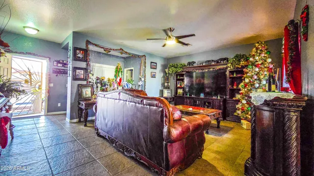 a living room filled with furniture and a chandelier