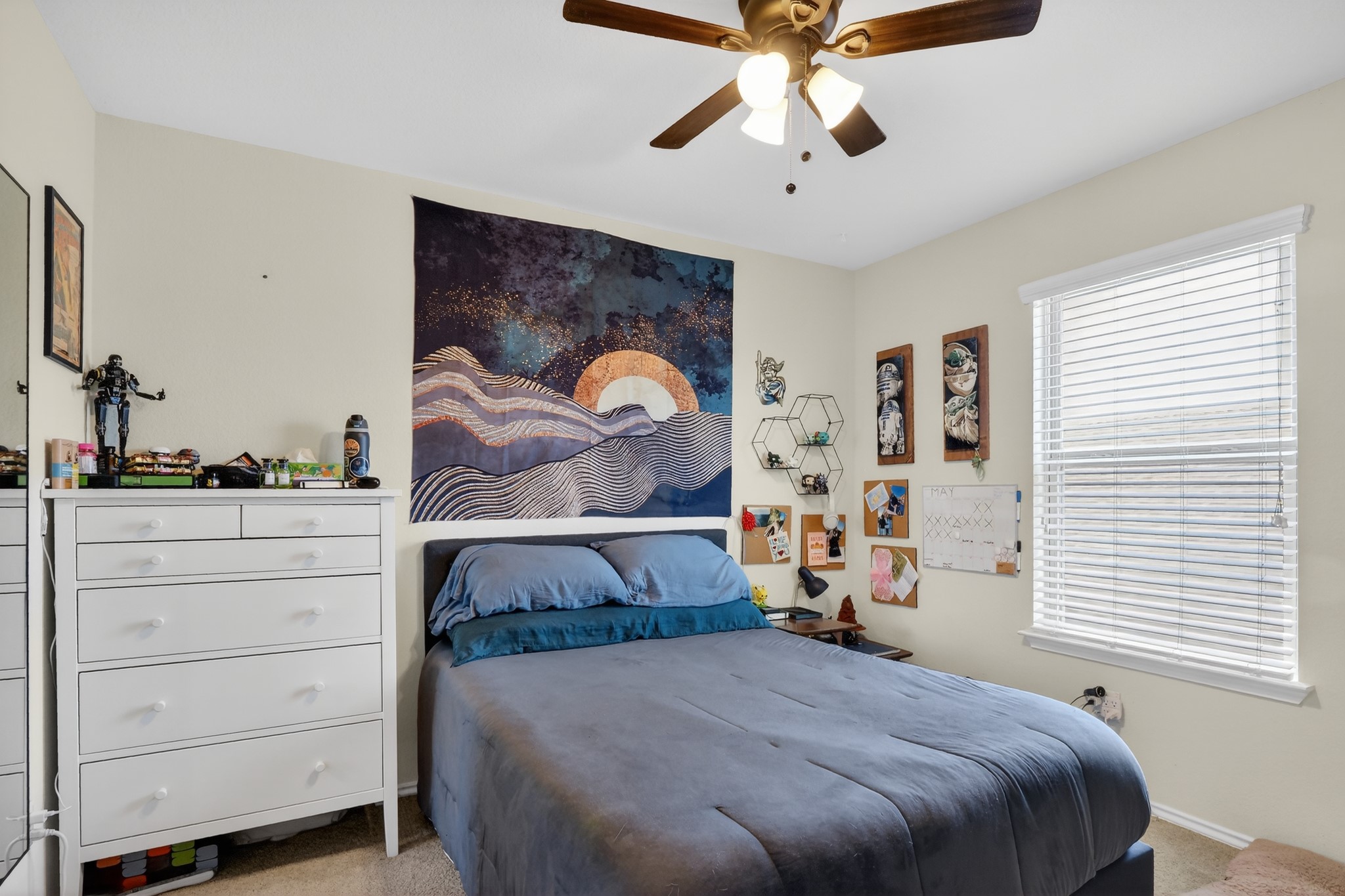 521 Staton Street Georgetown, TX 78626 - Photo 25 of 39 a bedroom with a bed and a chandelier