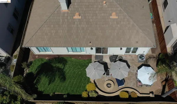 an aerial view of a fireplace with table and chairs
