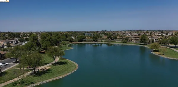 an aerial view of a house with a lake view