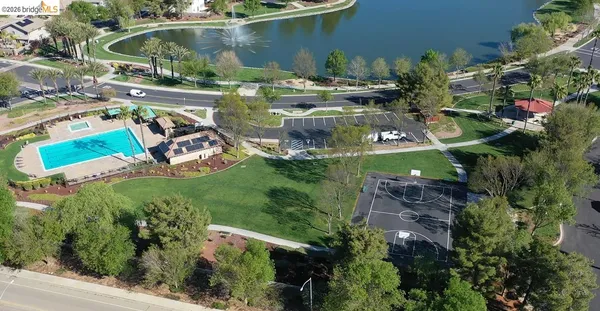 an aerial view of a house with yard swimming pool and outdoor seating