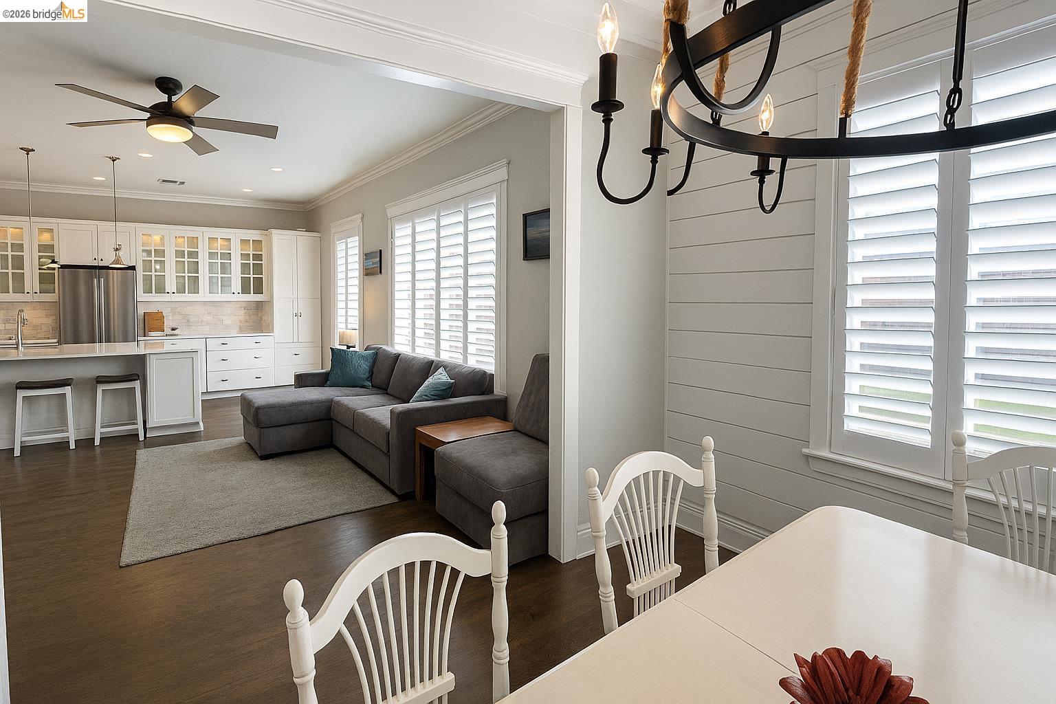 2072 Bridgeport Loop Discovery Bay, CA 94505 - Photo 7 of 26 Dining room with dark wood-type flooring, ornamental molding, a chandelier, recessed lighting, and ceiling fan