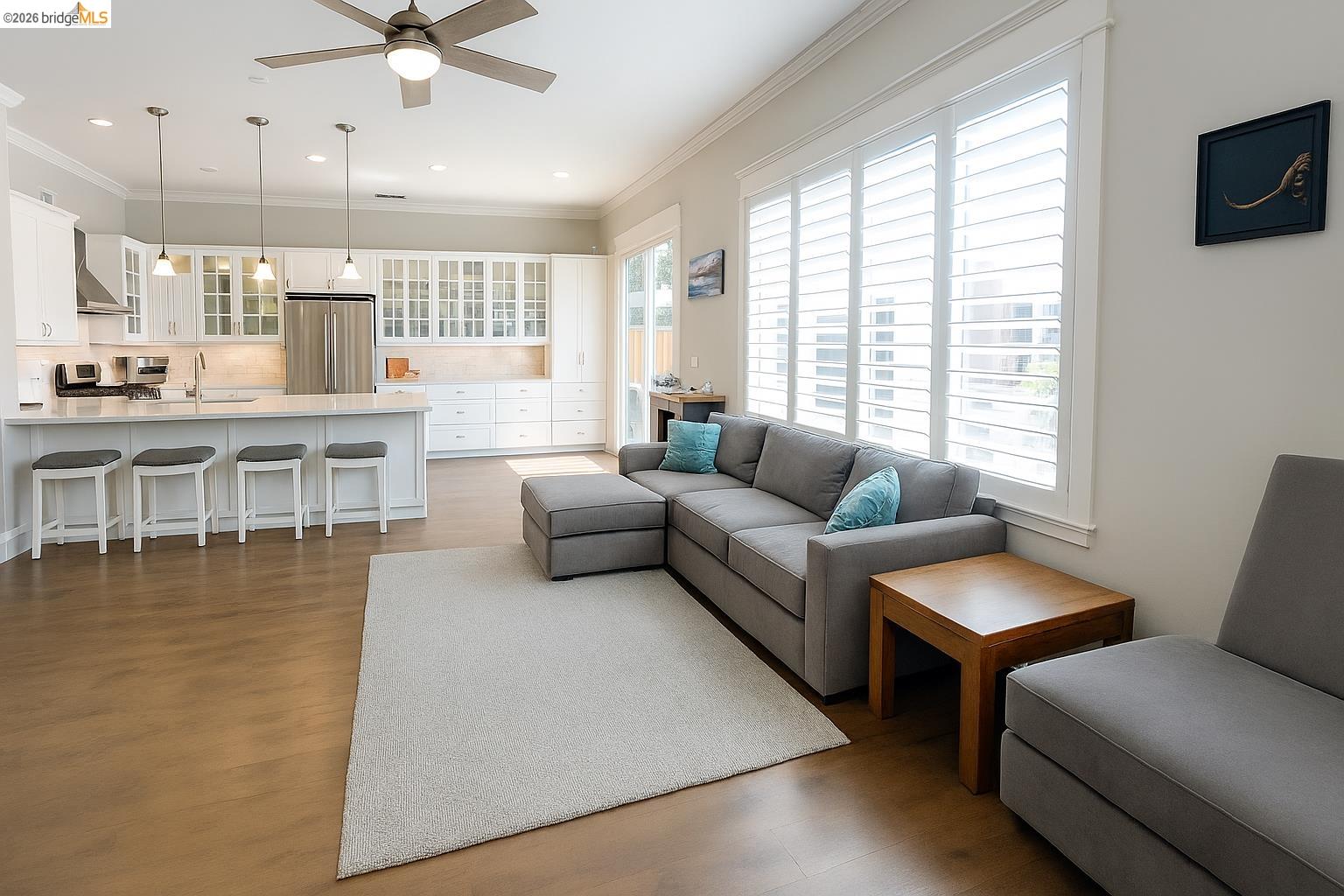 2072 Bridgeport Loop Discovery Bay, CA 94505 - Photo 8 of 26 Living area with ceiling fan, crown molding, dark wood-type flooring, and recessed lighting