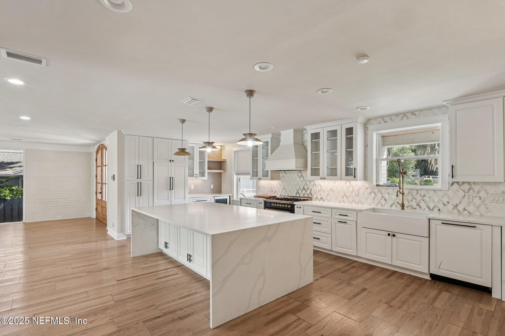 1536 Mayfair Road Jacksonville, FL 32207 - Photo 17 of 58 a large kitchen with a lot of counter space and wooden floor