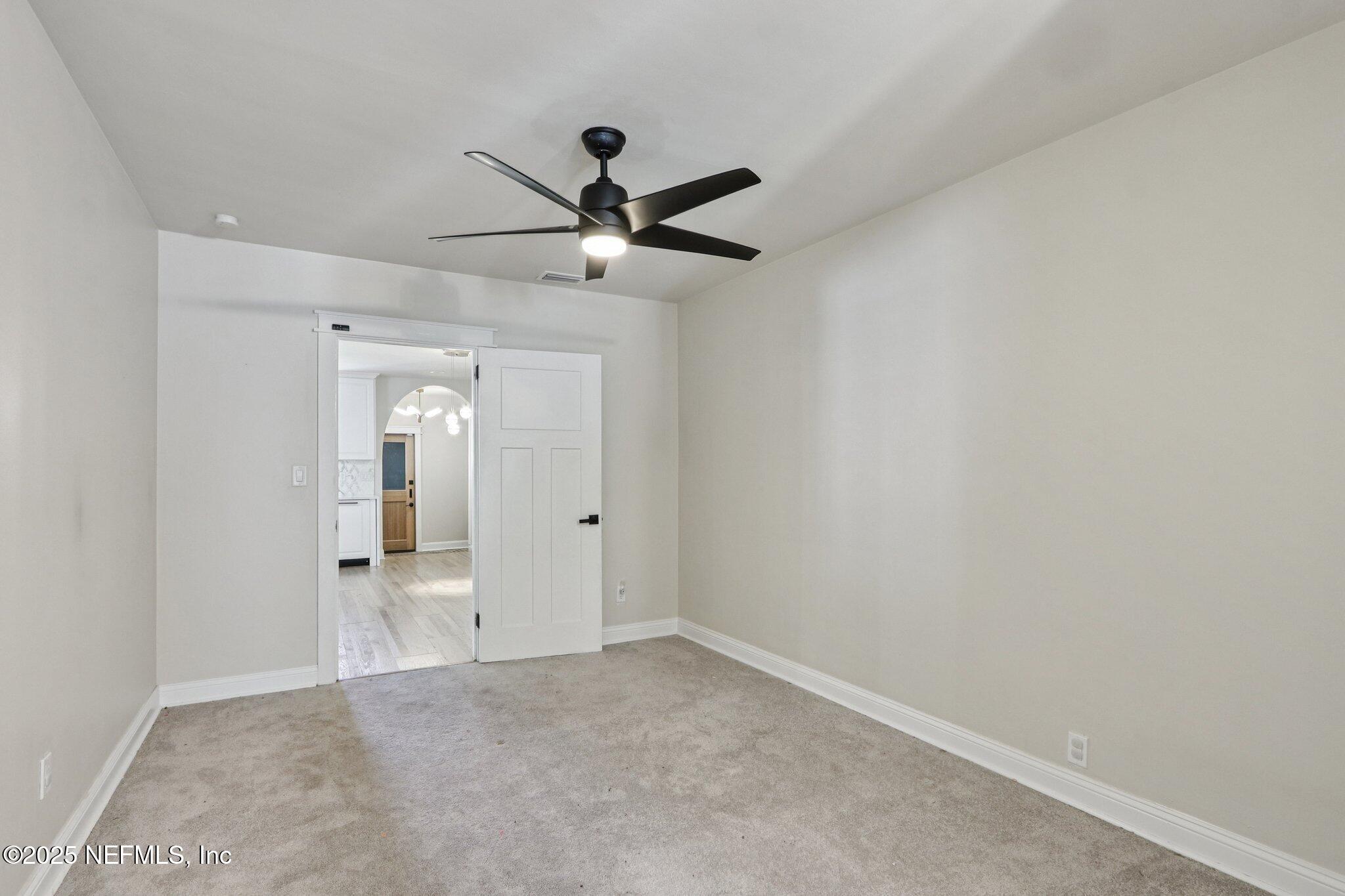 1536 Mayfair Road Jacksonville, FL 32207 - Photo 27 of 58 an empty room with closet and windows