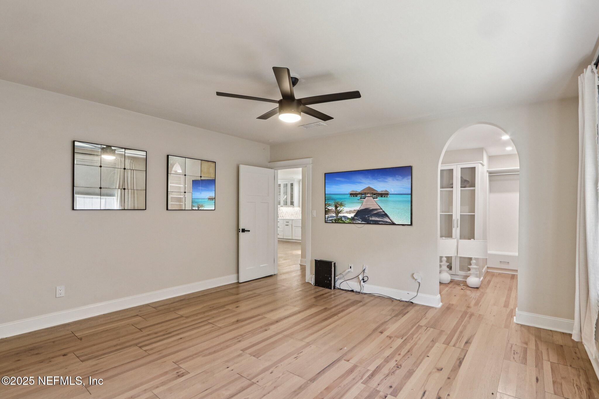 1536 Mayfair Road Jacksonville, FL 32207 - Photo 32 of 58 a view of a livingroom with wooden floor and a ceiling fan