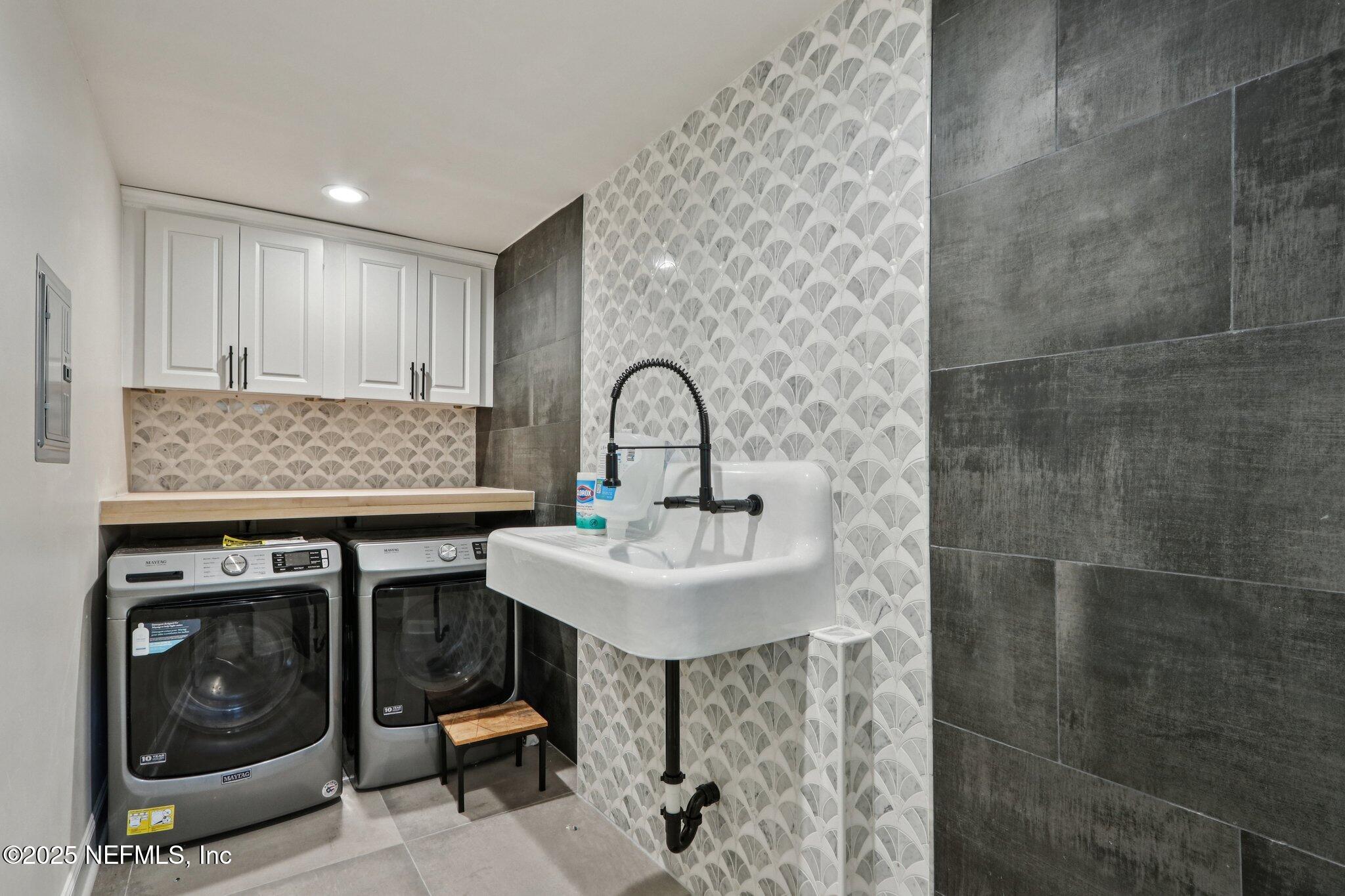 1536 Mayfair Road Jacksonville, FL 32207 - Photo 33 of 58 a kitchen with a sink a stove and a refrigerator