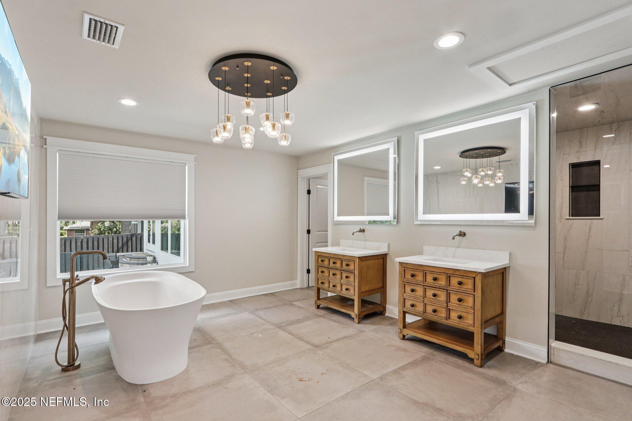 1536 Mayfair Road Jacksonville, FL 32207 - Photo 34 of 58 a bathroom with a toilet a sink and a mirror