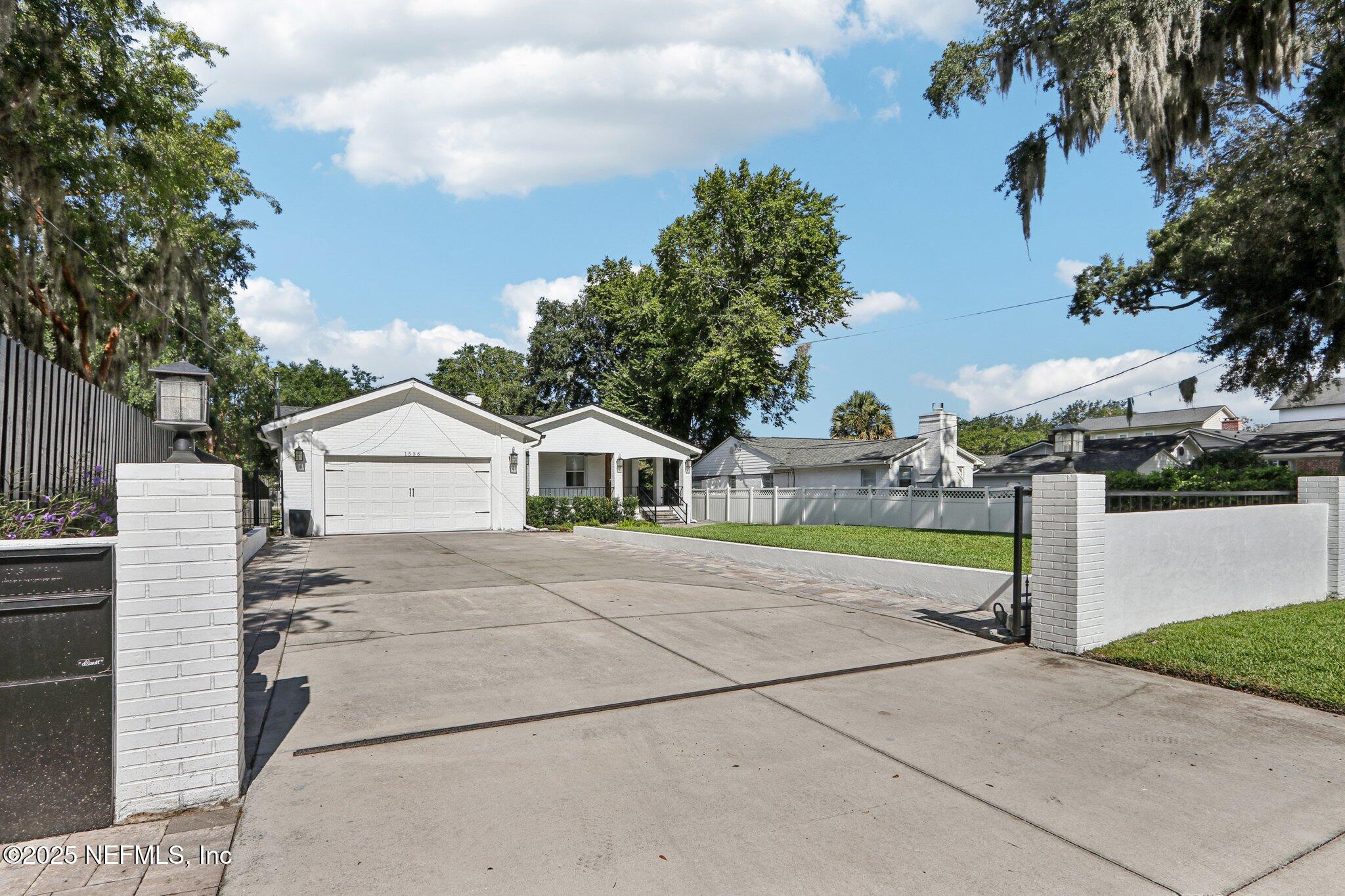 1536 Mayfair Road Jacksonville, FL 32207 - Photo 4 of 58 a view of a house with a yard and large tree